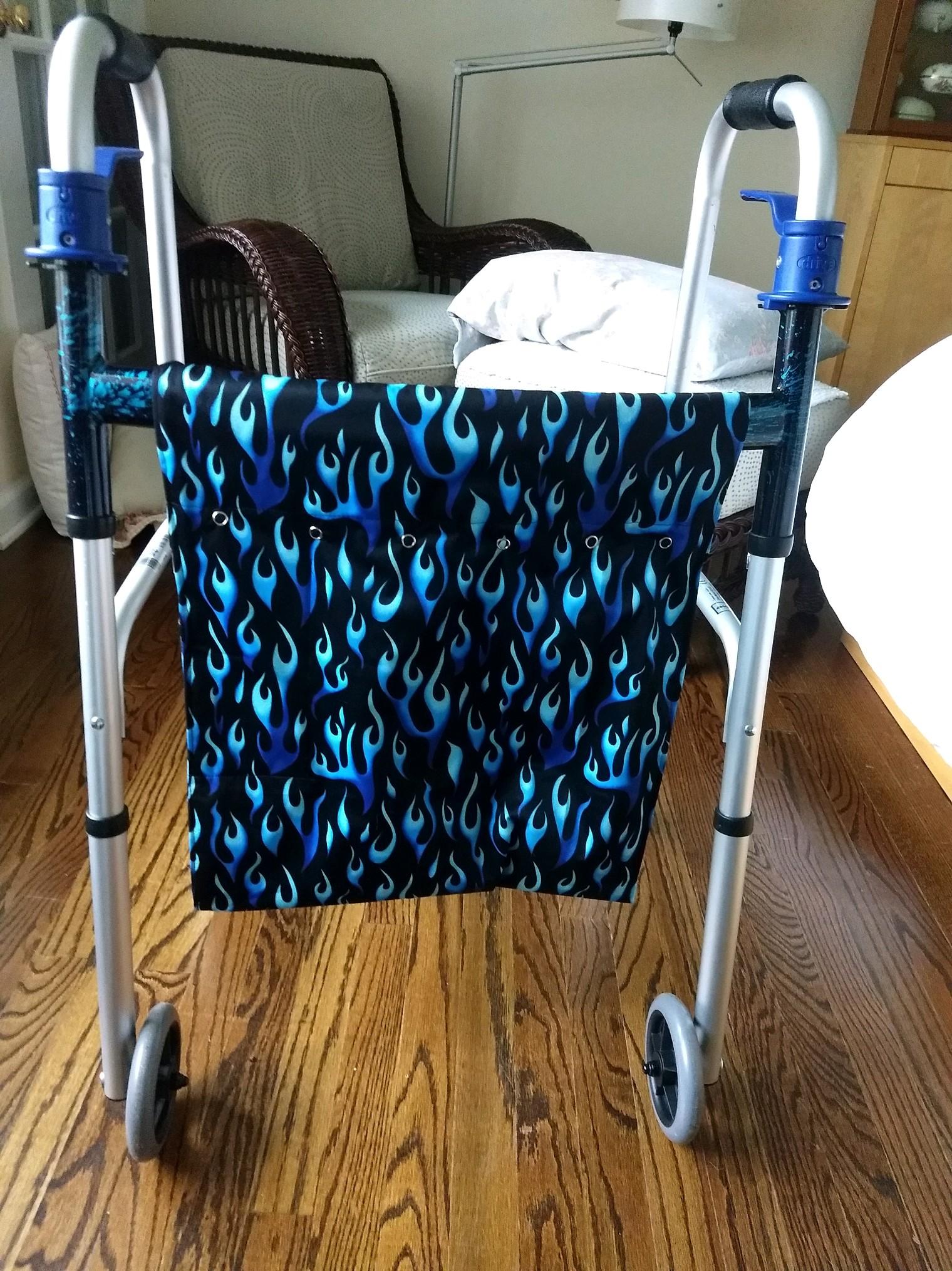 The black sewn bag with blue flames  on a walker